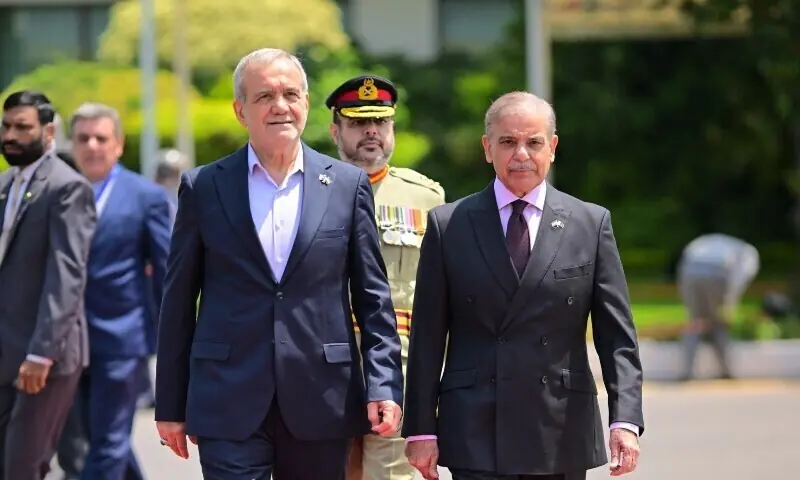 Iranian President  Masoud Pezeshkian (L) is received by Prime Minister Shehbaz Sharif (R) at PM house in Islamabad on August 3, 2025. &mdash; X/@GovtofPakistan/ File