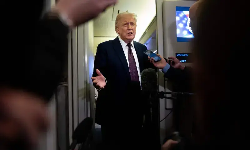US President Donald Trump speaks to members of the media onboard Air Force One on March 15, 2026 while en route to Joint Base Andrews, Maryland from West Palm Beach Florida. &mdash; AFP