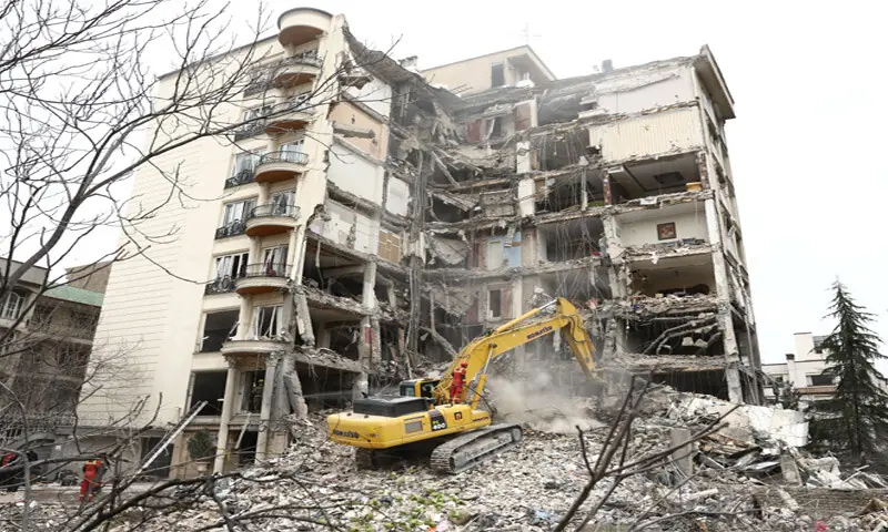 TEHRAN: An excavator clears rubble from a residential building, which was hit by an air strike as the US and Israel continued their bombing of Iran.&mdash;Reuters