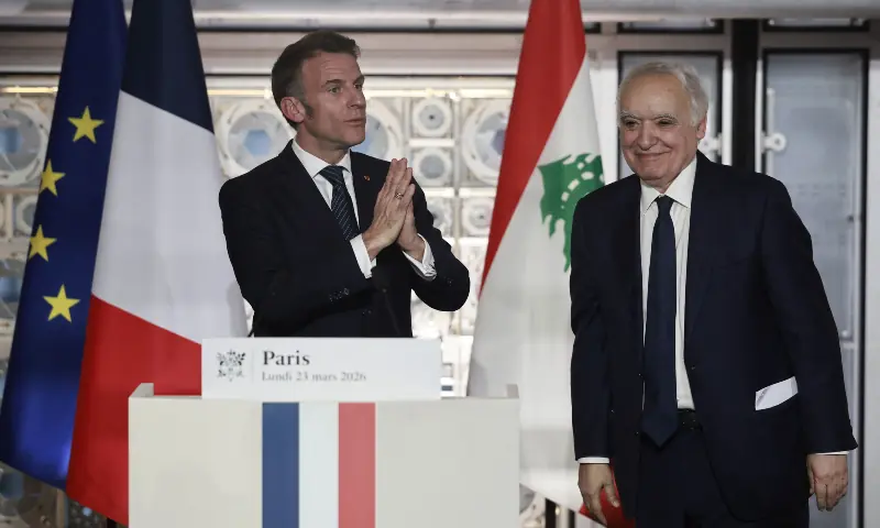 French President Emmanuel Macron (L) delivers a speech next to Lebanese Minister of Culture Ghassan Salame (R) during his visit to the exhibition &ldquo;Byblos, Lebanon&rsquo;s Millennial City&rdquo; at Arab World Institute (IMA) in Paris on March 23, 2026. &mdash; AFP