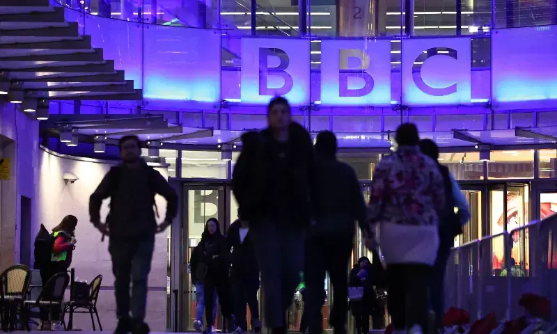 People use the entrance to the offices of British broadcaster BBC in London in the late afternoon on November 11, 2025. &mdash; AFP/File