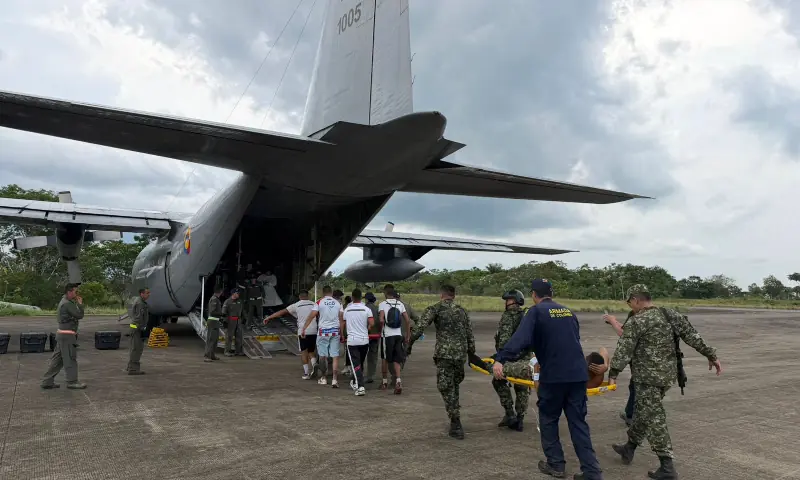 A handout photo released by the Colombian Armed Forces shows members of the Colombian Aerospace Force lifting injured people on stretchers to be loaded onto an aircraft in Puerto Leguizamo, Colombia, near the southern border with Ecuador, on March 23, 2026. &mdash; AFP