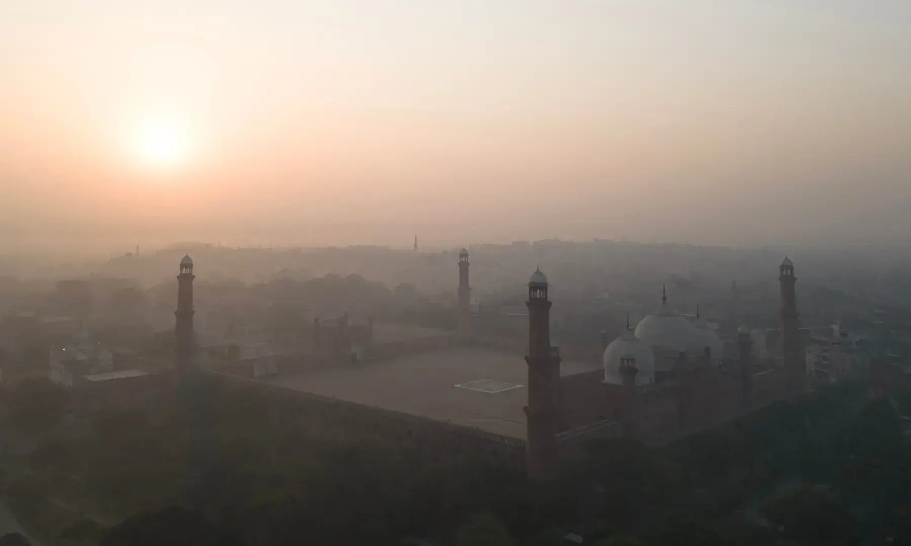 An aerial view shows the Badshahi Mosque engulfed in smog during sunrise in Lahore on October 25, 2025. &mdash; AFP/File
