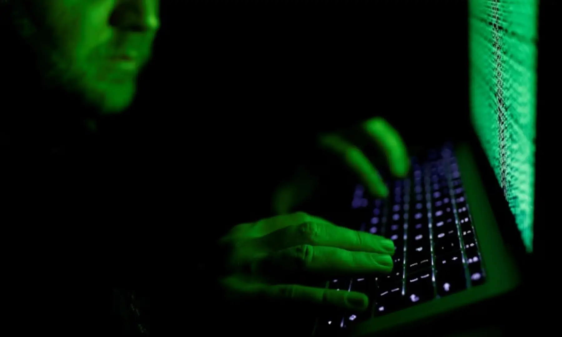 A man types on a computer keyboard in front of the displayed cyber code in this illustration picture taken on March 1, 2017. &mdash; Reuters/File