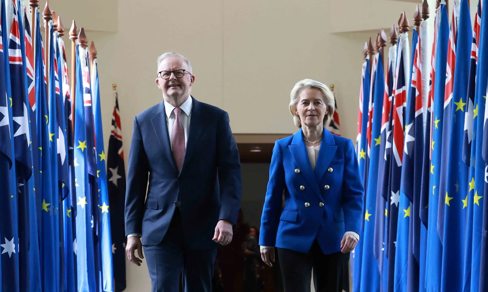 European Commission President Ursula von der Leyen (R) and Australian Prime Minister Anthony Albanese walk through the corridors of Parliament House in Canberra on March 24, 2026. &mdash; AFP