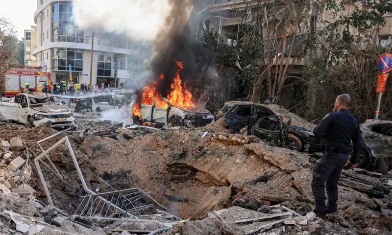 TEL AVIV: Emergency personnel respond at the site of an Iranian missile strike in central Israel.&mdash;Reuters