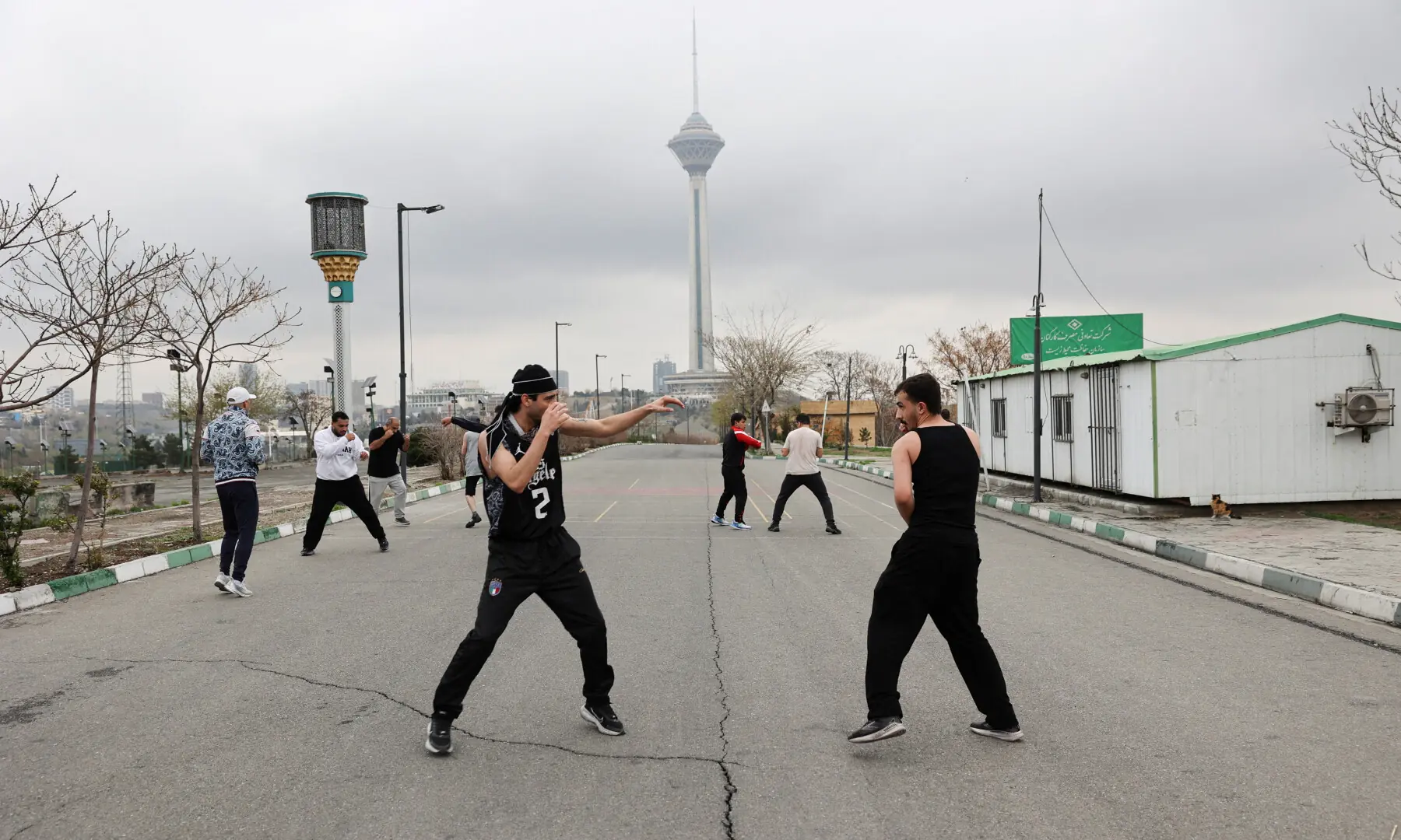 Iranian people exercise at Pardisan Park, amid the US-Israeli war on Iran, in Tehran, Iran on March 25, 2026. &mdash; WANA via Reuters
