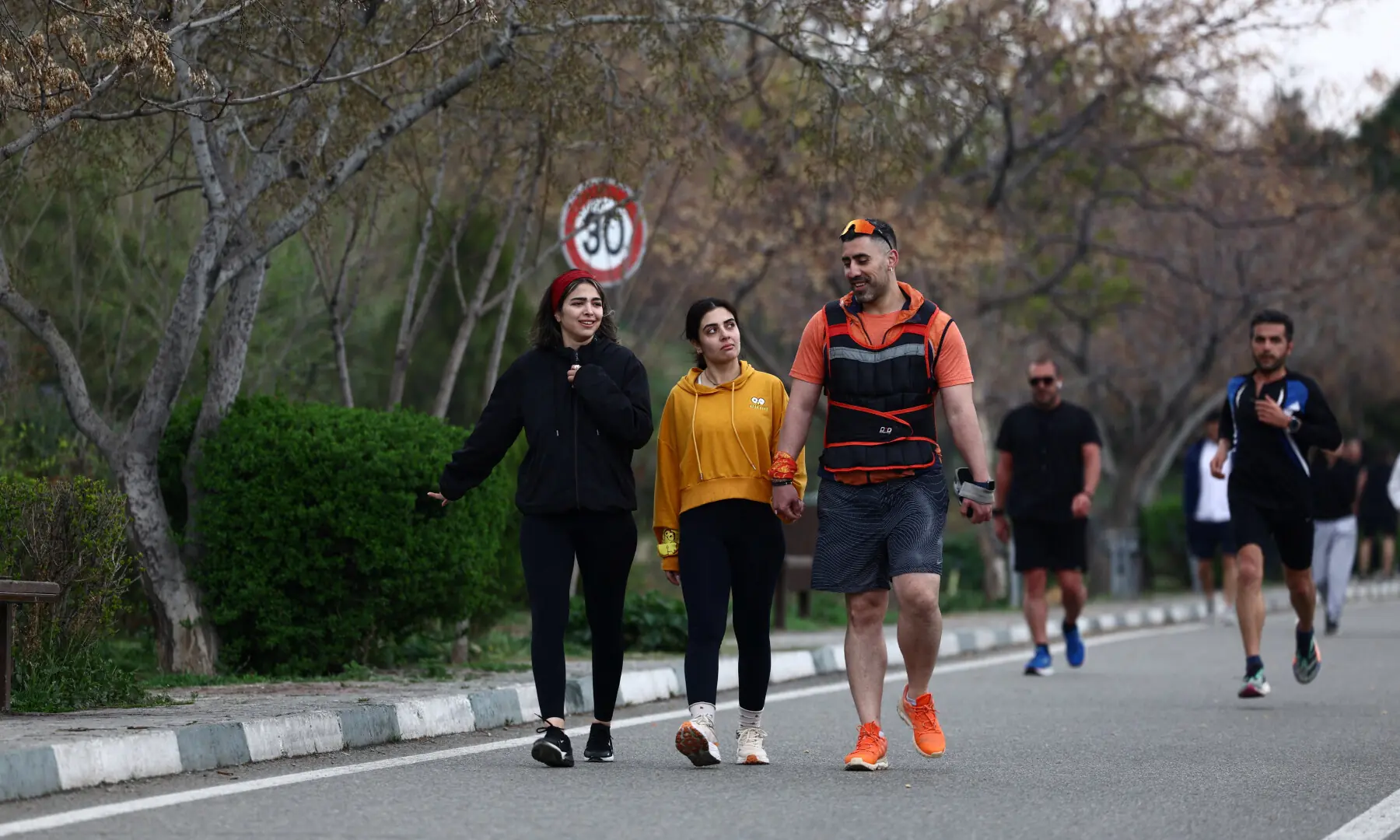 Iranian people walk at Pardisan Park, amid the US-Israeli war on Iran, in Tehran, Iran on March 25, 2026. &mdash; WANA via Reuters