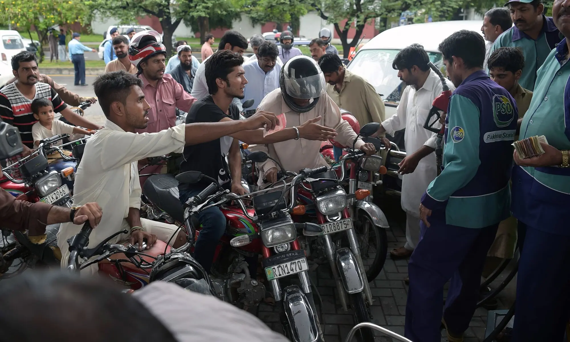 Commuters queue for fuel at PSO station amid a countrywide strike. —AFP/File Commuters queue for fuel at PSO station amid a countrywide strike. —AFP/File