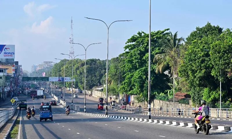 Commuters ride along a deserted street in Colombo on March 25, 2026 after Sri Lanka introduced a four-day work week to conserve fuel reserves amid the Middle East war. — AFP Commuters ride along a deserted street in Colombo on March 25, 2026 after Sri Lanka introduced a four-day work week to conserve fuel reserves amid the Middle East war. — AFP
