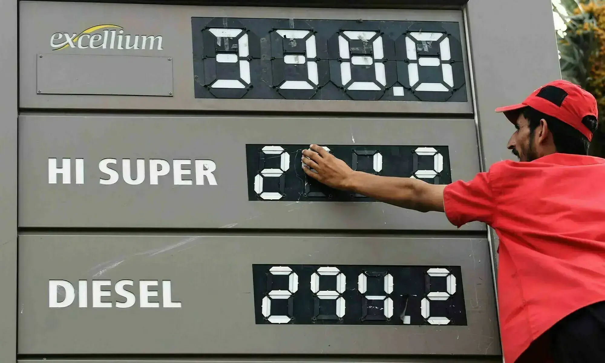 An employee updates the fuel prices at a fuel station in Karachi on August 16, 2024 in this file photo. &mdash; AFP/File