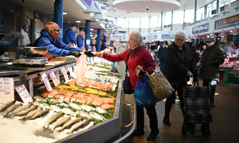 BURY: A shopper buys fresh items in Manchester. Britain&rsquo;s annual inflation was steady at 3pc in February, data showed ahead of an expected jump as the Gulf war has sent oil prices surging.&mdash;AFP