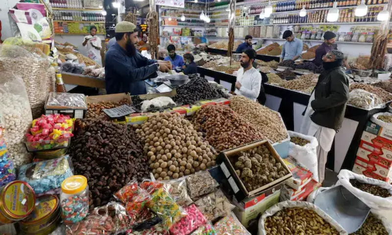 People buy dry fruits at a market in Karachi on February 1, 2023. — Reuters/File People buy dry fruits at a market in Karachi on February 1, 2023. — Reuters/File