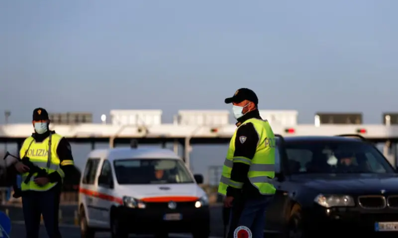 Italian police officers patrol the motorway in Rome. — Reuters Italian police officers patrol the motorway in Rome. — Reuters