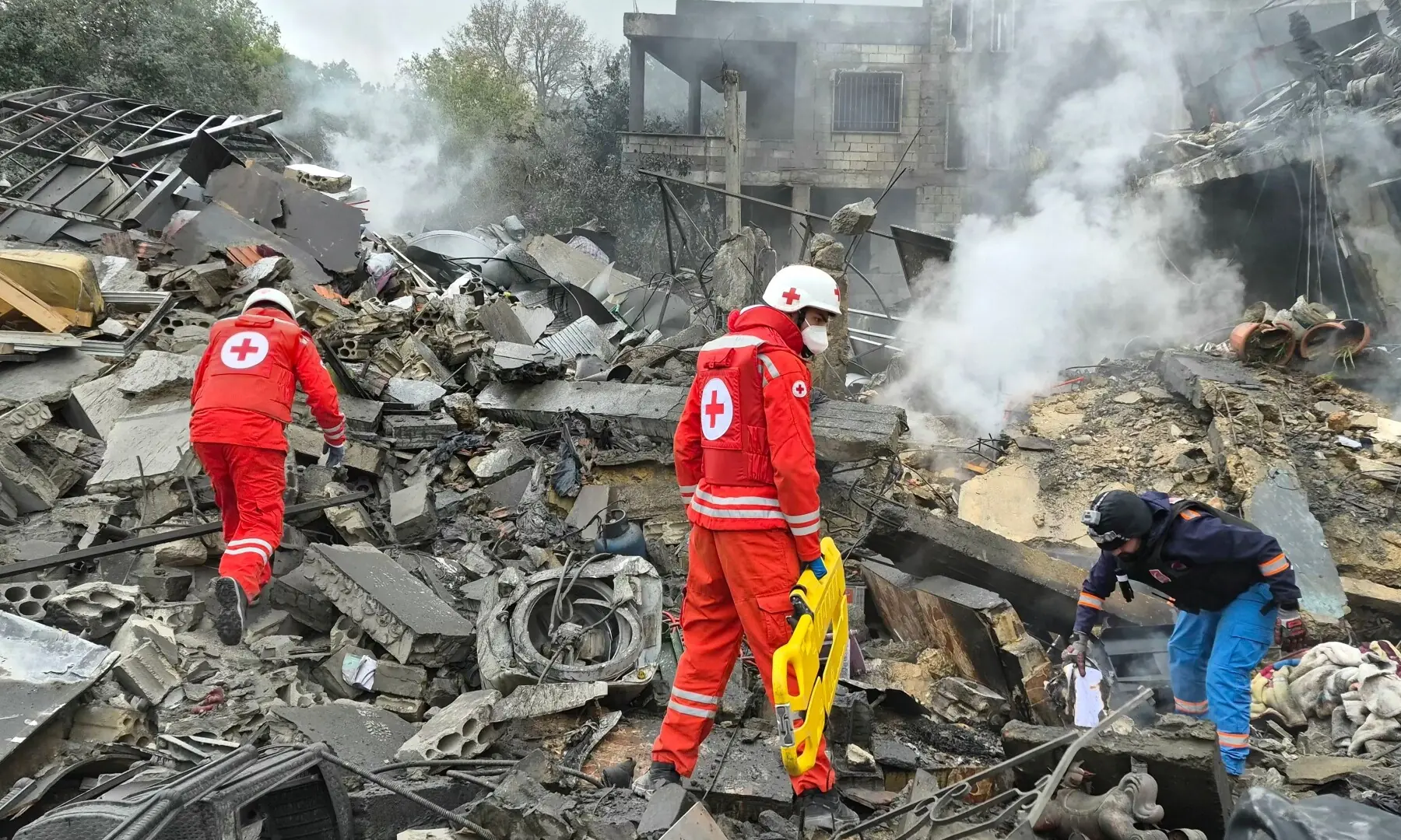 First aid responders are seen at the site of an Israeli airstrike that targeted the southern Lebanese village of Kfar Roummane on March 26, 2026. &mdash; AFP