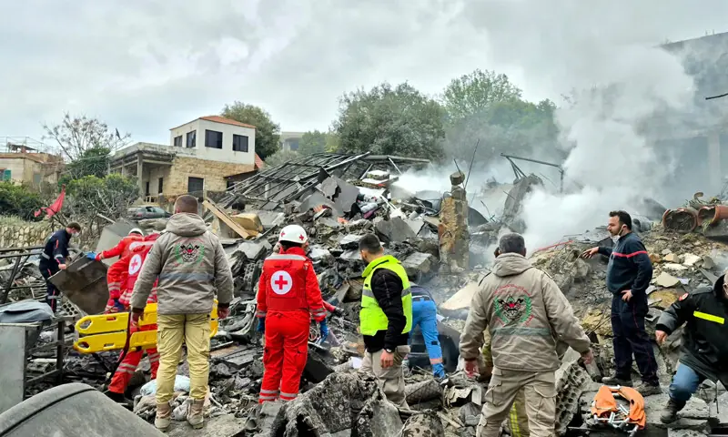 First aid responders at the site of an Israeli air strike that targeted a village in southern Lebanon.—AFP First aid responders at the site of an Israeli air strike that targeted a village in southern Lebanon.—AFP
