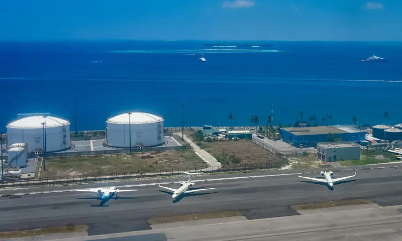 MALE: Chartered planes stand on the tarmac beside fuel storage tanks at Velana International Airport on Thursday, as global energy markets face disruptions amid ongoing conflict in the Middle East.&mdash;AFP
