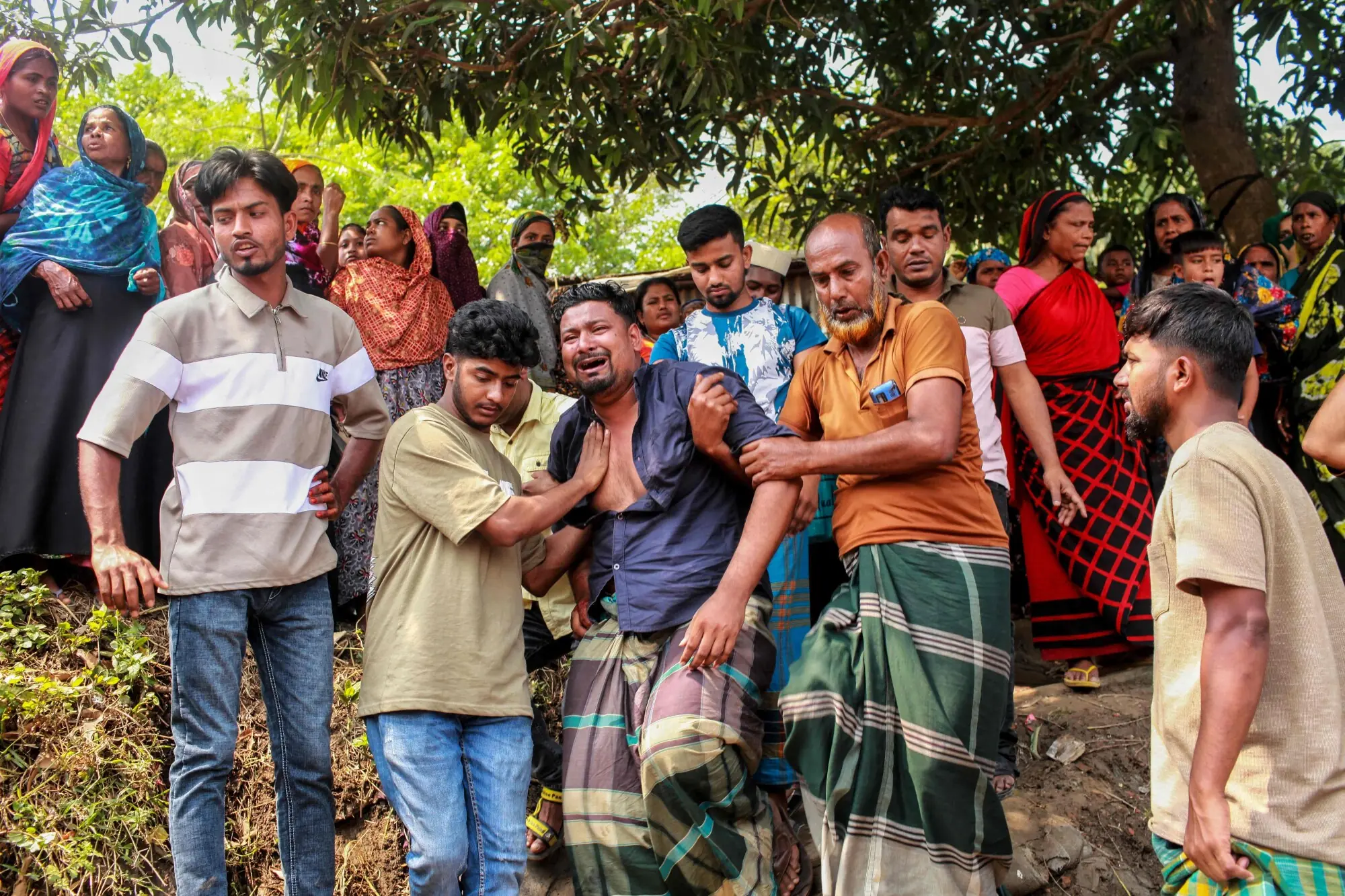 Relatives mourn as they console one another after a bus plunged into the Padma River in Goalanda in Bangladesh’s Rajbari district on March 26, 2026. — AFP Relatives mourn as they console one another after a bus plunged into the Padma River in Goalanda in Bangladesh’s Rajbari district on March 26, 2026. — AFP