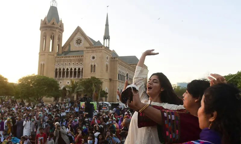 Participants taking part in Aurat March at Karachi&rsquo;s Frere Hall in 2021: gatherings such as this provide space for highlighting women&rsquo;s issues in an evolving national and global scenario | AFP