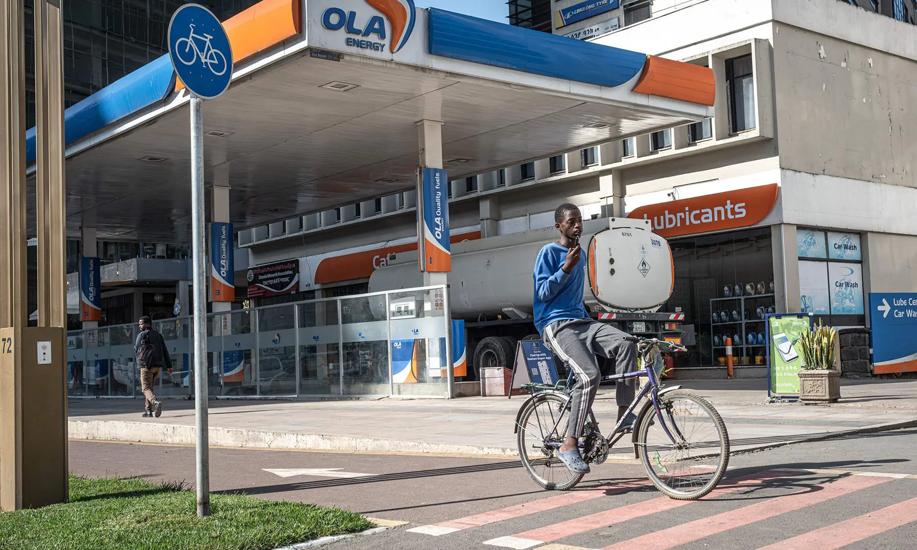A cyclist passes in front of a closed petrol station during a fuel shortage in Addis Ababa, Ethiopia on March 27. &mdash; AFP