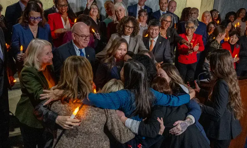 Victims of convicted sex offender Jeffrey Epstein share a hug after learning that the US Senate passed the &ldquo;Epstein Files Transparency Act&rdquo; while participating in a candlelight vigil to honor survivors of his crimes in Washington, DC on November 18, 2025. &mdash; AFP/File
