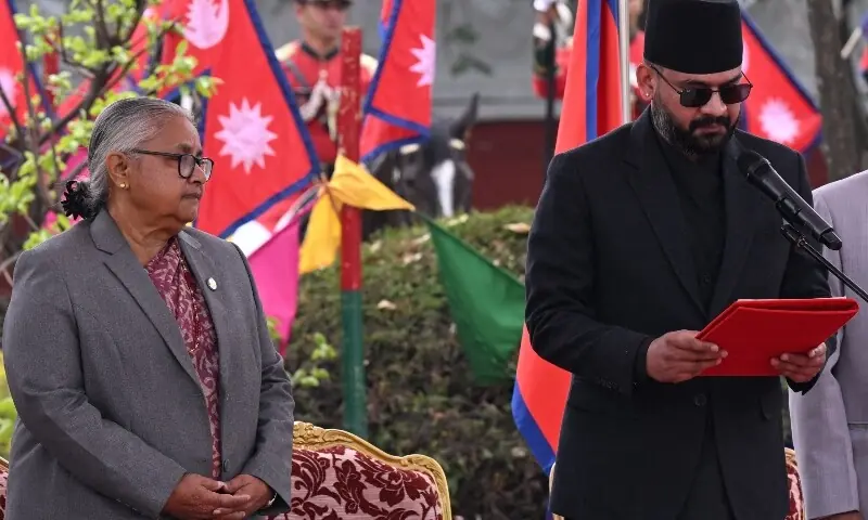 Rastriya Swatantra Party (RSP) leader Balendra Shah takes oath as Nepal&rsquo;s new prime minister as former interim prime minister Sushila Karki looks on during a swearing-in ceremony in Kathmandu on March 27, 2026. &mdash;AFP