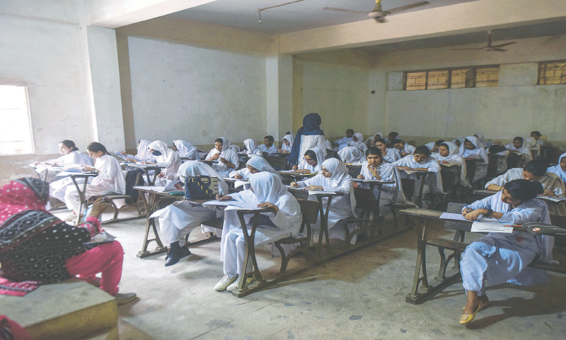 Students take their first paper at the Abdullah Govt College For Women North Nazimabad on Saturday.&mdash;Fahim Siddiqi / White Star