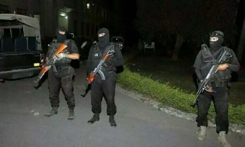 Punjab CTD personnel stand guard on a road at night. — Punjab Police CTD/File Punjab CTD personnel stand guard on a road at night. — Punjab Police CTD/File