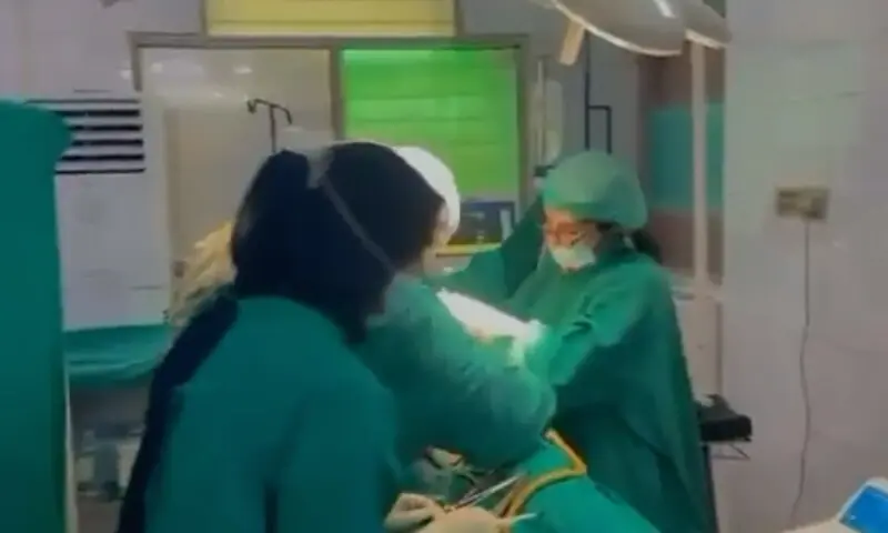 This image fromt he video in question shows the doctors during a medical procedure. — Screenshot from video provided by author This image fromt he video in question shows the doctors during a medical procedure. — Screenshot from video provided by author