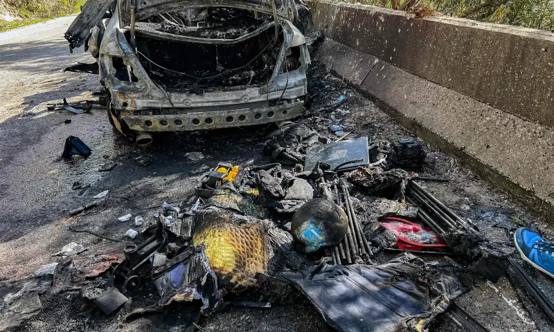Gear that was used by a media crew of journalists who were killed in an Isareli strike earlier is displayed near the husk of their destroyed vehicle along the side of a road leading to Jezzine in southern Lebanon on March 28, 2026. &mdash; AFP