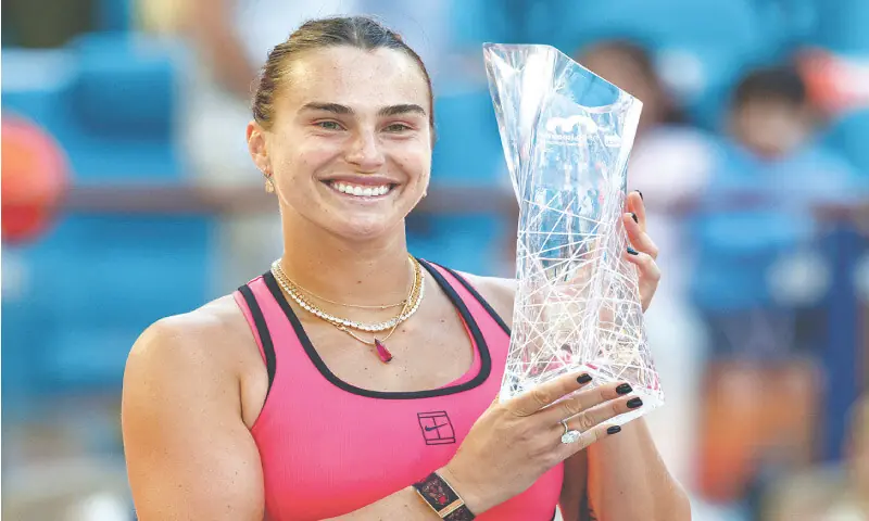 BELARUS&rsquo; Aryna Sabalenka poses with the winner&rsquo;s trophy after defeating Coco Gauff of the US in the Miami Open final at the Hard Rock Stadium.&mdash;Reuters