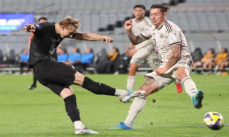 AUCKLAND: New Zealand’s Ben Waine (L) shoots to score against Chile during their international friendly at Eden Park on Monday.—AFP AUCKLAND: New Zealand’s Ben Waine (L) shoots to score against Chile during their international friendly at Eden Park on Monday.—AFP