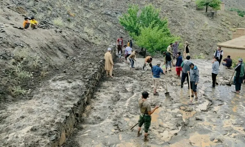 Afghan residents shovel mud following flash floods after heavy rainfall at Pesgaran village in Dara district, Panjshir province, Afghanistan on July 15, 2024. — AFP/File Afghan residents shovel mud following flash floods after heavy rainfall at Pesgaran village in Dara district, Panjshir province, Afghanistan on July 15, 2024. — AFP/File