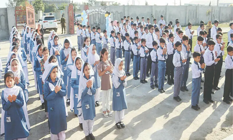 Students of District Public School attend the morning assembly as academic activities commenced in the first state-of-the-art school in Attock. — Dawn/File Students of District Public School attend the morning assembly as academic activities commenced in the first state-of-the-art school in Attock. — Dawn/File