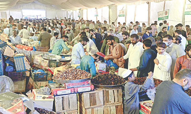 People shopping at the Ramazan Bazaar near Allama Iqbal Park in Rawalpindi: before the start of Ramazan, prices of food items start to rise as demand picks up, with perishable items leading the charge | White Star