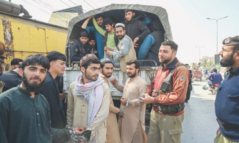 Afghan refugees being brought to a local court in Peshawar  on Sunday. &mdash; Photo by Abdul Majeed Goraya