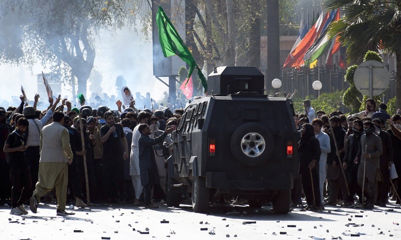 A MOB surrounds an armoured personnel carrier on Islamabad&rsquo;s Constitution Avenue.&mdash;Mohammad Asim