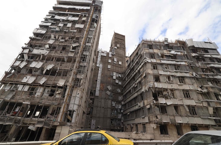 The damaged facade of Tehran’s Gandhi Hospital is seen after it was hit by an Israeli strike.—AFP