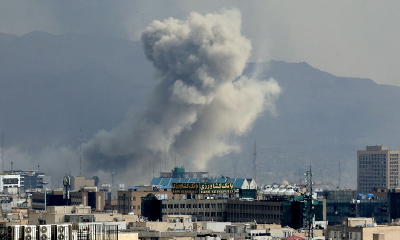 TEHRAN: A plume of smoke rises after a US-Israeli strike as loud explosions were heard in the central and eastern parts of the Iranian capital.&mdash;AFP