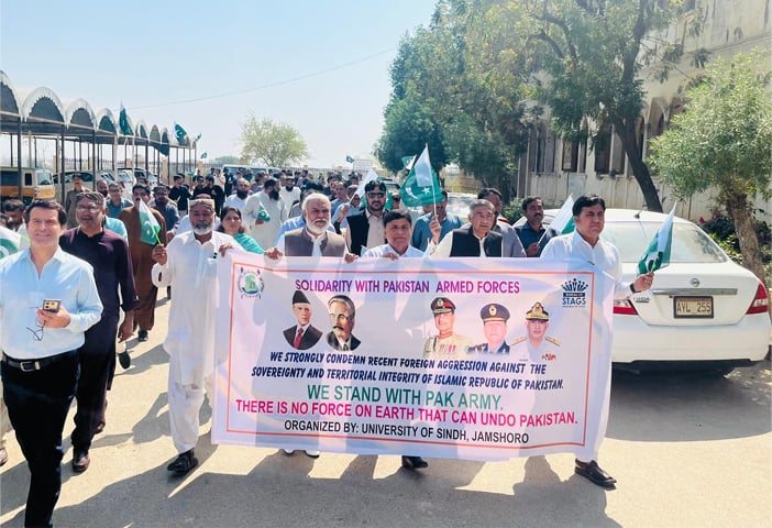 SINDH University faculty leads the rally on the campus.—Dawn