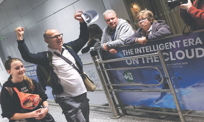 A passenger gestures upon arrival at the airport in Frankfurt, Germany, from Dubai.—Reuters A passenger gestures upon arrival at the airport in Frankfurt, Germany, from Dubai.—Reuters