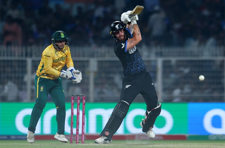KOLKATA: New Zealand opener Finn Allen drives as South African wicket-keeper Quinton de Kock looks on during their semi-final at the Eden Gardens on Wednesday.&mdash;Reuters