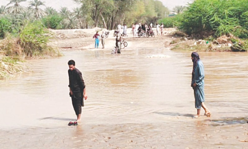 Water enters a village in Paharpur tehsil, Dera Ismail Khan, on Thursday after a breach in Chashma Right Bank Canal. &mdash; Photo by Muhammad Irfan Mughal