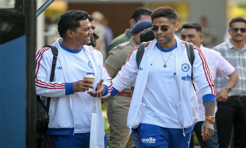 AHMEDABAD: Indian captain Suryakumar Yadav (R) arrives at Ahmedabad airport ahead of the T20 World Cup final against New Zealand 
on Friday.&mdash;AFP