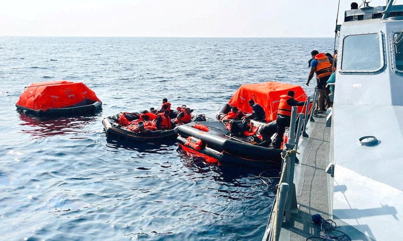 Sri LankaN Navy personnel assist Iranian sailors during a rescue operation after responding to a distress call from their vessel.&mdash;Reuters