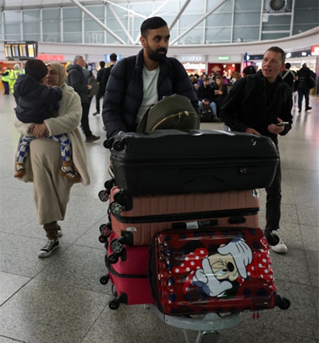  A man exits the terminal at London&rsquo;s Stansted Airport on a government-chartered flight.&mdash;Reuters 