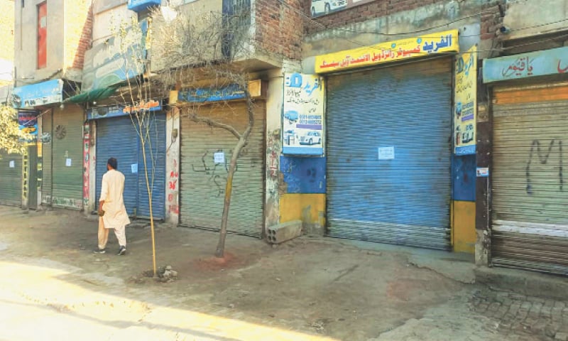 SAHIWAL: Shops sealed over rent default. &mdash; Dawn