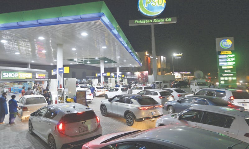 Motorists throng a filling station in Peshawar on Friday night in anticipation of an increase in petroleum prices. &mdash; White Star