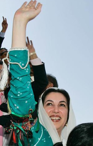Benazir Bhutto reacts as she disembarks the plane that brought her from Dubai to Karachi on October 18, 2007 | AP