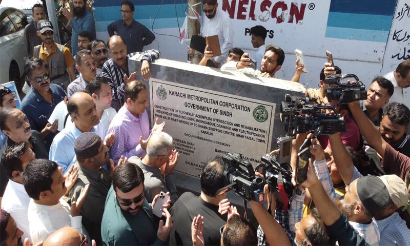 Mayor Murtaza Wahab joins others in prayer after laying the foundation stone of the new flyover project.&mdash;Dawn